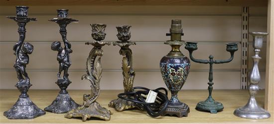 A pair of Putti candlesticks, two others and a lamp tallest 26cm